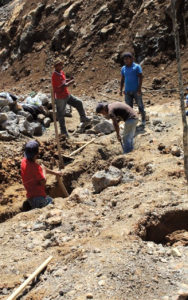 Preparation for the church sanctuary's foundation has been difficult because of the rocky ground.