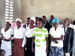 Center staff sings during inauguration ceremony